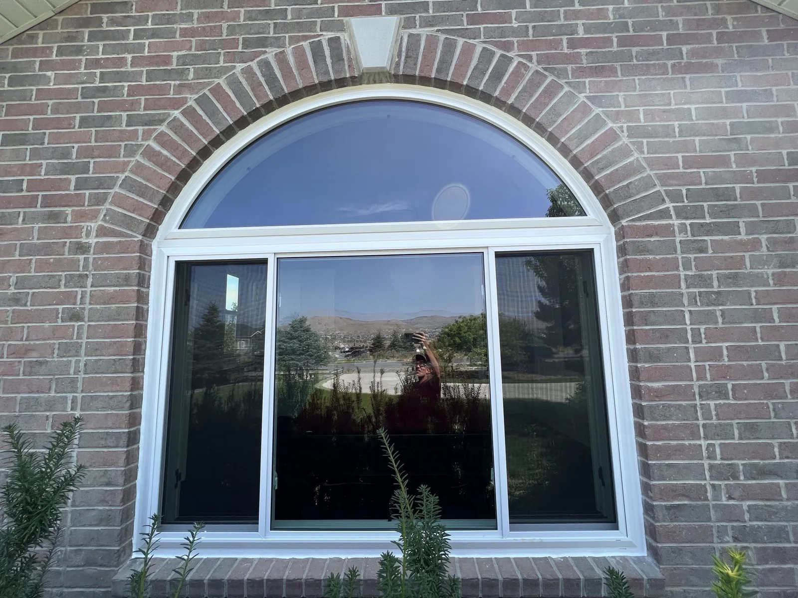 Arched window in a brick opening
